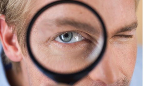 magnifying-glass-held-to-eye